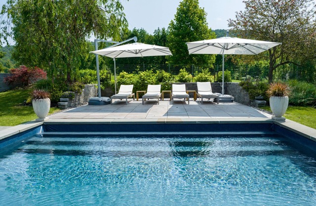 3 bedroom house with a heated pool