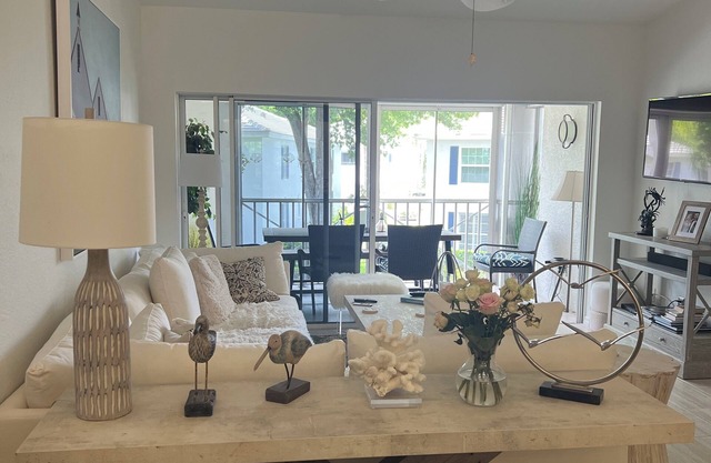 3 BR coach house at The Barrington Club in Pelican Bay. Private beach access.