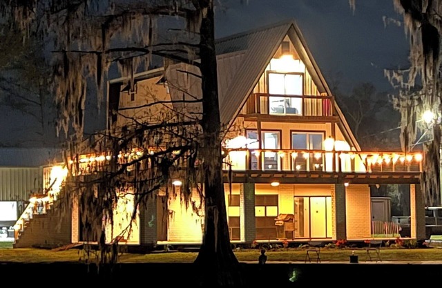 3 levels, 3 bed room spacious waterfront home is located in the Maurepas Swamp