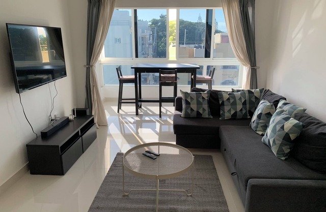 4-bedroom condo Steps from Ocean w/Pier, parking, WiFi, AC, parks & shopping.
