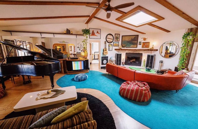 80s dreamworld with waterfall lagoon, bowling lane, hot tub under the Milky Way