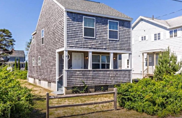 A beautiful single-family cottage sits only a 1/2 block from the sandy beach!