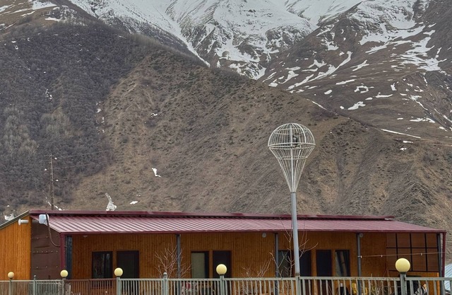 A studio apartment at a secluded area by the river, surrounded by mountains.