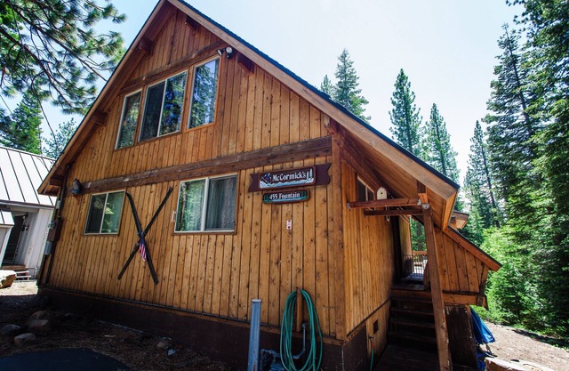 A super cabin on Tahoe's West Shore with PRIVATE BEACH RIGHTS. Up against forest