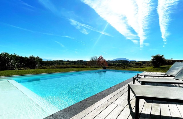 Architect-designed villa with exceptional mountain views close to the beach, ideal for families