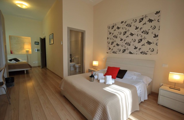 Aria Rome Rooms triple room with balcony view of Basilica di San Giovanni