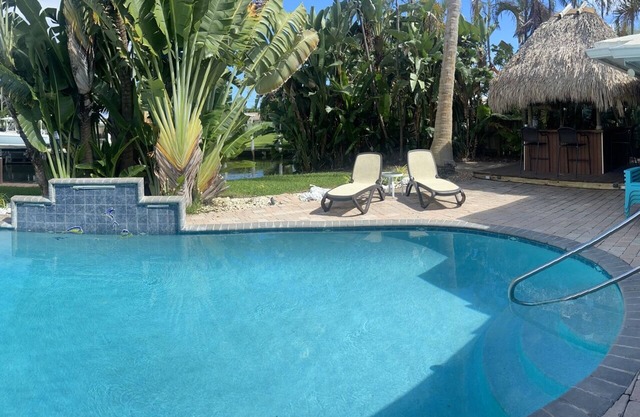 Backyard Paradise: 2bd/2bath Waterfront Home, Heated Salt Water Pool, Tiki Bar