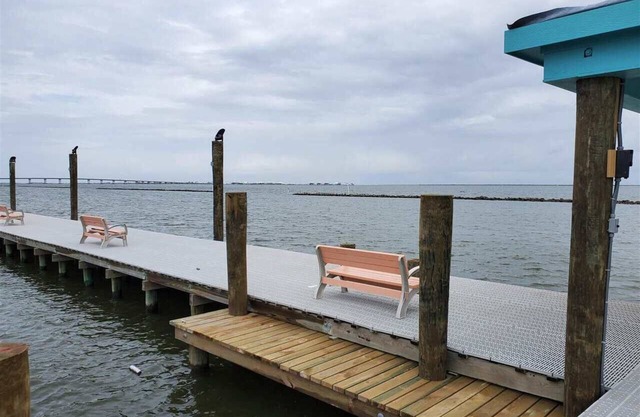 Baywinds Condo 8: Spacious 3BR waterfront retreat in Grand Isle, LA with boat access.