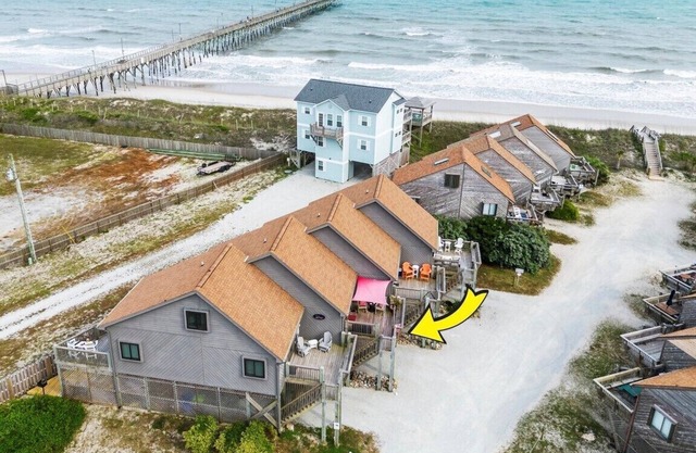 Beachfront townhome, private beach access, outdoor space & amenities.