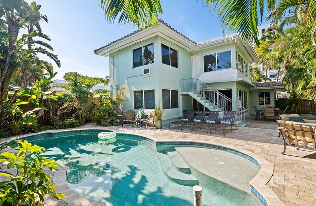 Beautiful Beach House with pool, lush tropical landscaping steps from the ocean