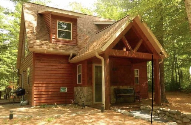 Beautiful, comfortable 2 bedroom cabin with a loft on a lake in the woods.