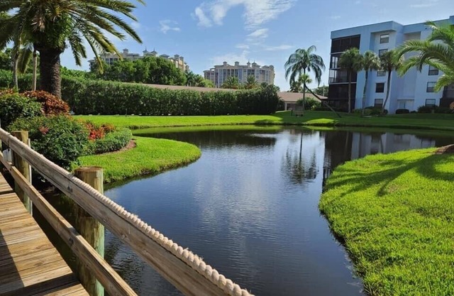 Beautiful condo located directly on the River with pool side & lake views