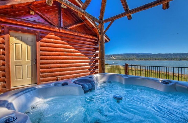 Beautiful lakefront estate, hot tub, 180-degree views, game room, and BBQ grill!