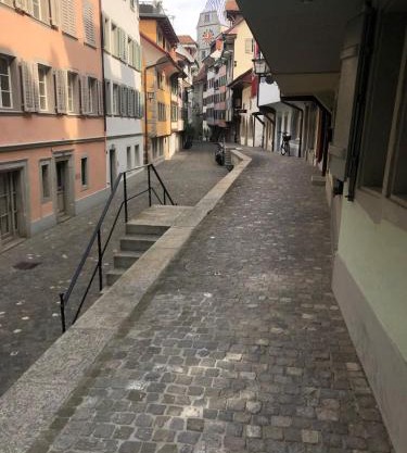 Bedroom cum office with shared shower in Zug's Old Town