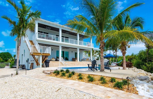 Brand New Single Family 5/5 -90ft dock, pool, paddle boards, bicycles plus more!