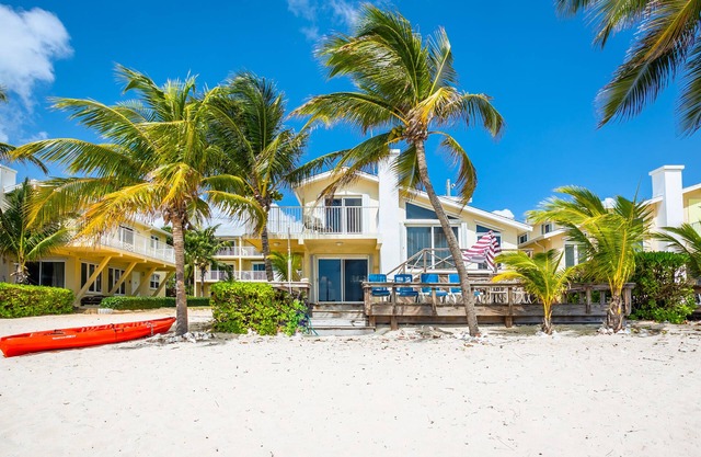 Caribbean Paradise – Beachfront Villa South Sound Beauty and Resort Amenities