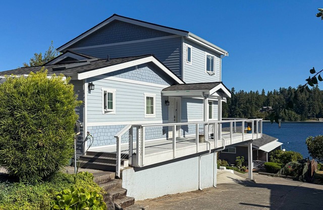 Centrally located waterfront home with ocean view, home office, grill, fireplace