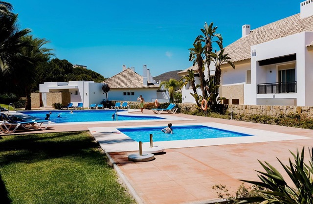 Chalet 'Comodo Triplex La Cala Golf' with Shared Pool, Wi-Fi and Air Conditioning