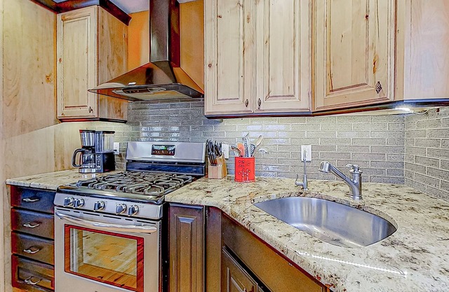 Charming & sun-filled nature escape with large deck, wood stove, fire pit, & W/D