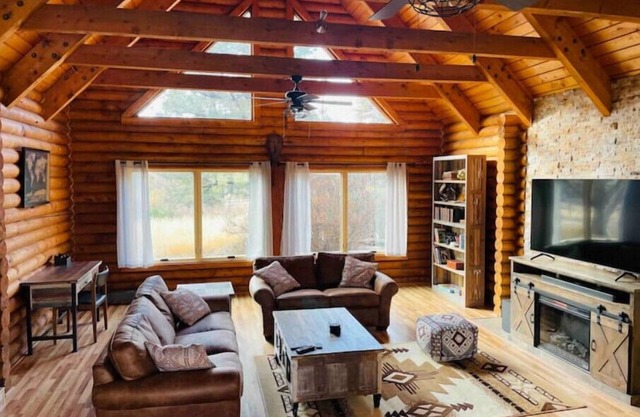 Cheerful Cabin with large stone patio and hot tub, next to trails!