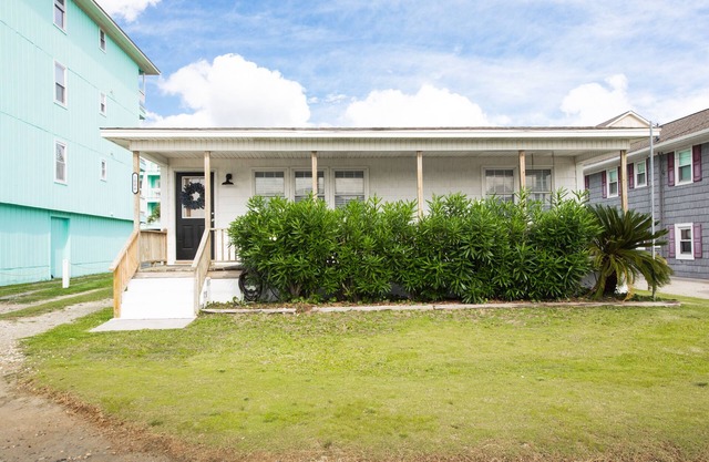Classic Beach Cottage with front porch view of water