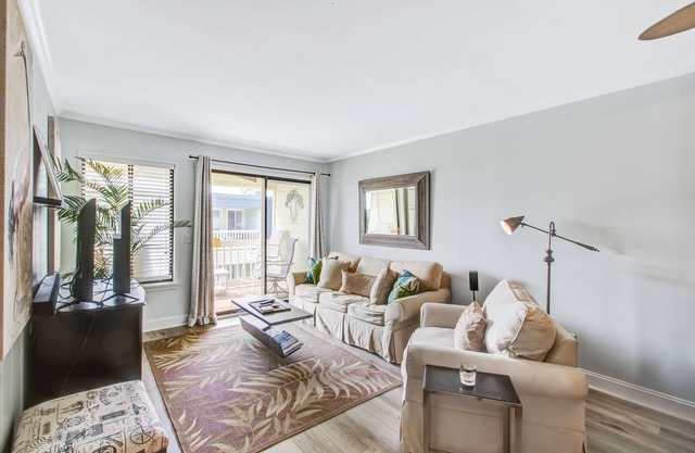 Comfortable villa one row away from the beach w/shared pool & grills