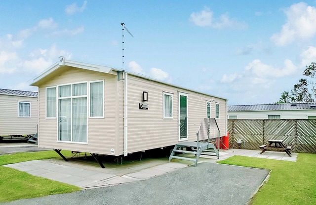 Contemporary 12ft-wide caravan with one double and one twin.