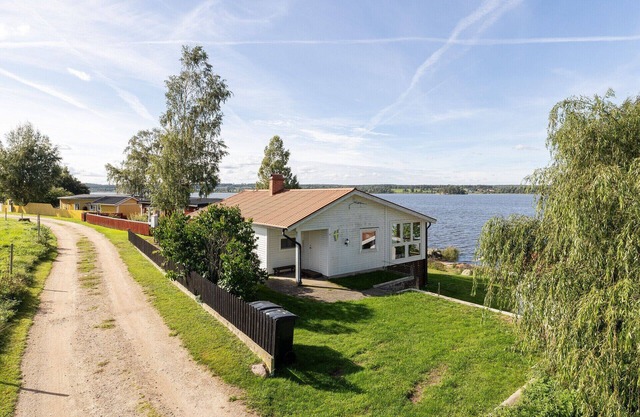 Cottage with its own sandy beach near VimmerbyI SE05018