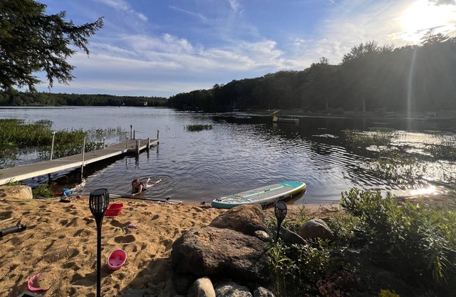 Cozy home with private beach on Huntress Pond and short drive to skiing!