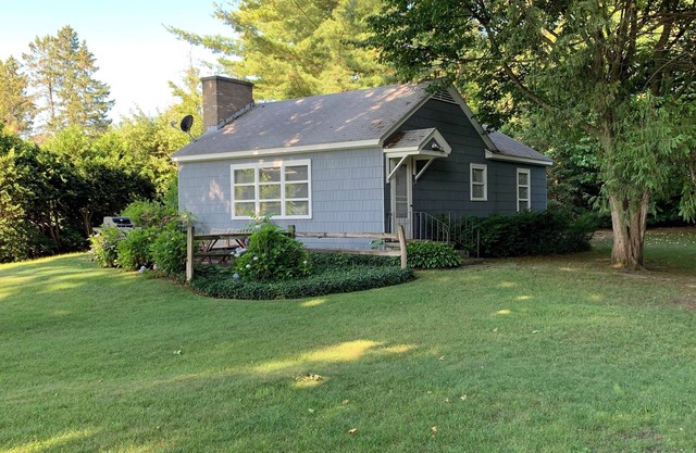 Cozy Lake Leelanau Cottage with waterfront access, views, terrace and central ac