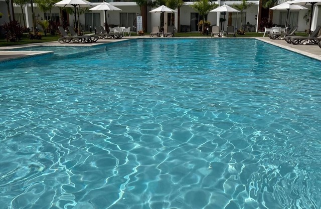 Cozy vacation home away from home. Enjoy the pool from your door step. n