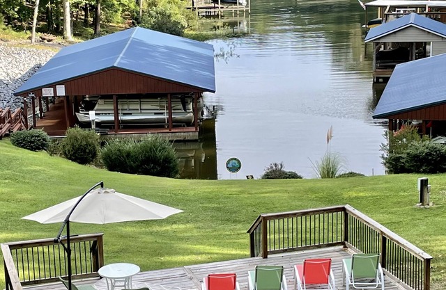 Cozy waterfront retreat in a quiet cove directly off main lake.