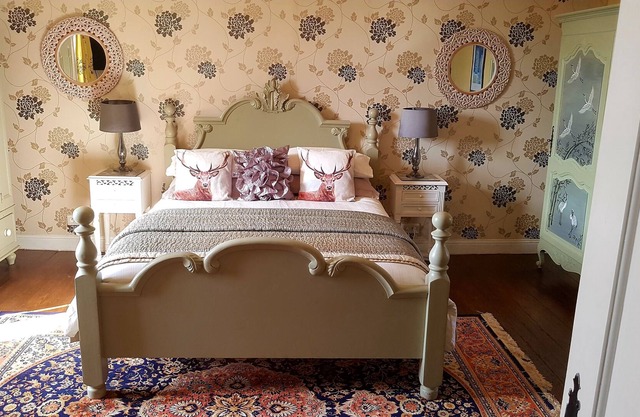 Deluxe Studio room, with kingsize bed and roll top bath.