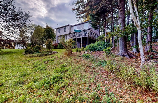 Dog-friendly 3-story home with wood stove, deck, grill, ocean views, W/D, AC