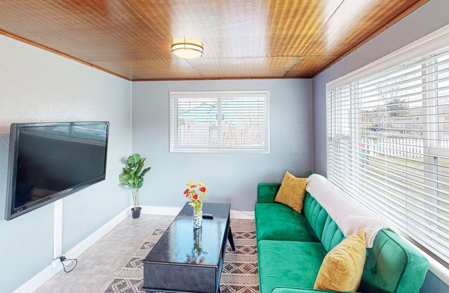 Dog-friendly home in a prime location with fenced yard, full kitchen, & foosball