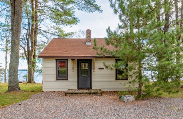 Dog-friendly lakefront cabin with on-site swimming, fishing, & rec room