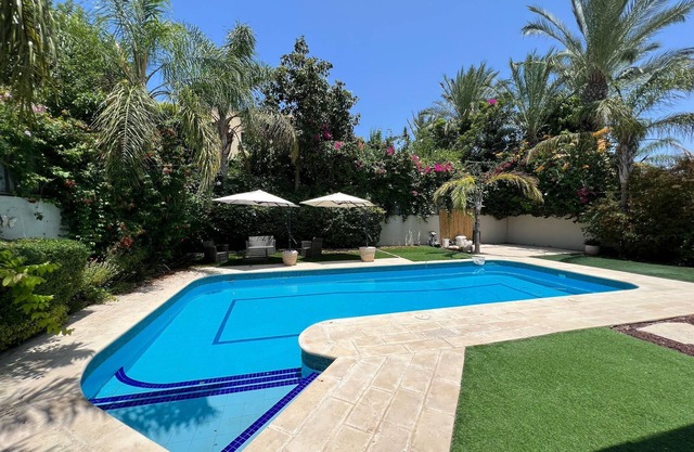 Elegant 5BR Haven with Sparkling Pool & Serene Garden Oasis