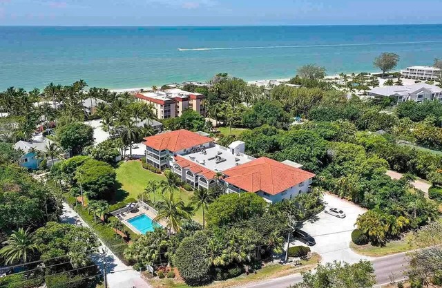 End unit with extra windows. Steps to the beach, private beach access!