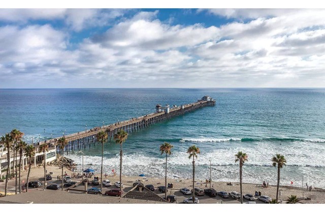 Enjoy the waves of the beach across from the Oceanside Pier