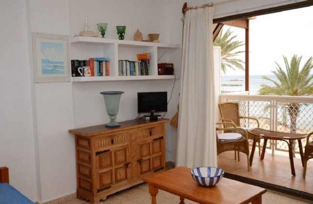 Es Pujols: Apartment on the seafront of Es Pujols with splendid views