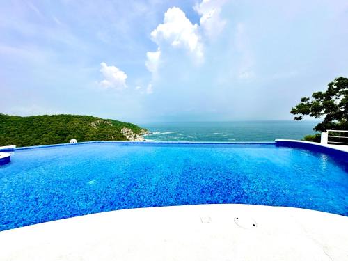 Exclusivo Bungalow frente a la playa, alberca nueva con vista infinita al mar, 8 hermosas playas cercanas, terraza con cama de playa y espectacular vista al océano pacífico! Nómadas digitales Starlink WiFi 203 mbps