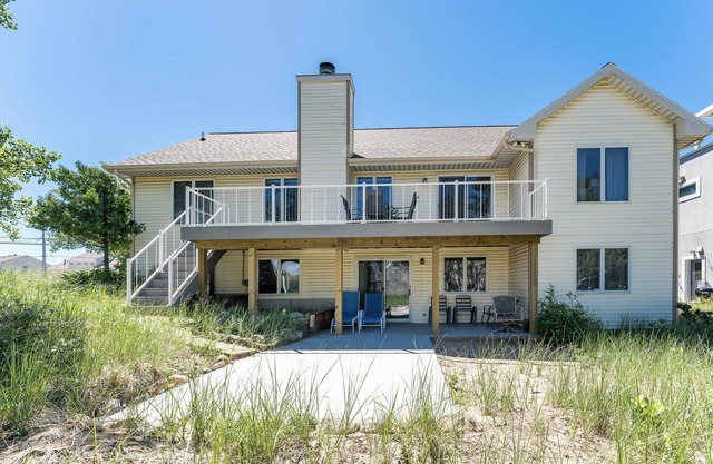 Experience lakeside luxury at Sunset Cove, a spacious 5-bedroom home