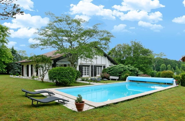 Experience this Basque Style Retreat with Charming Gardens and Heated Pool