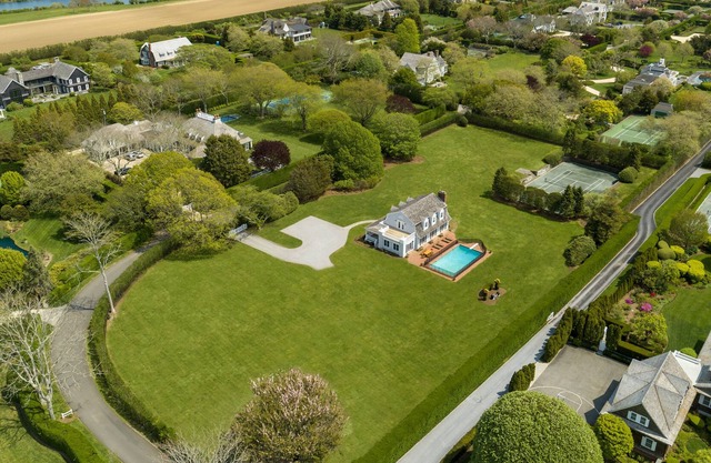 Family friendly home with private beach access with tennis court on 2.6 acres.