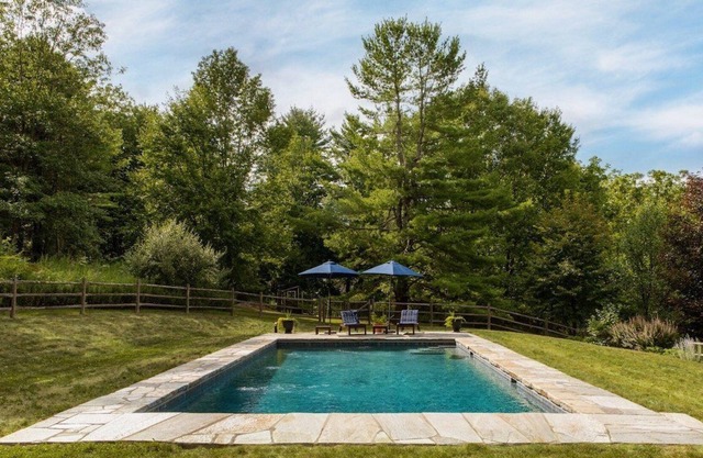 Farmhouse retreat with private pool, outdoor shower, fire pit.