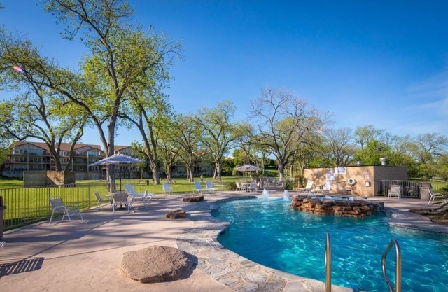 Fully Furnished Riverfront Property Heated Pools 2 Bedroom Home by RedAwning