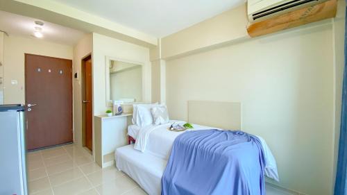 Good Place and Tidy Studio Tifolia Apartment By Travelio