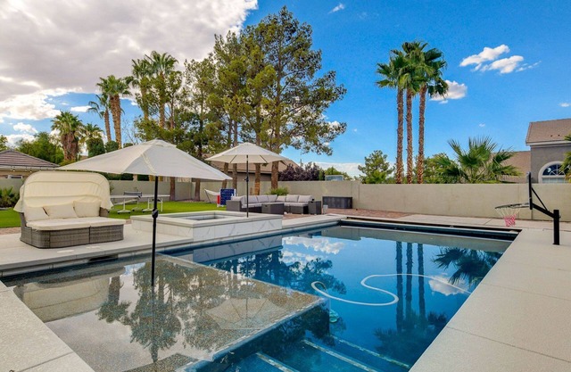 Grand custom home with resort-style backyard. 12 mins to the strip!
