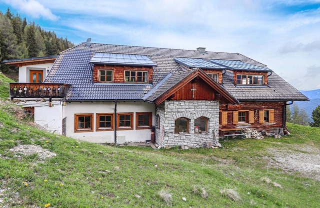 High above the village of Mauterndorf in Salzburger Land lies this old farmhouse on a hillside in th