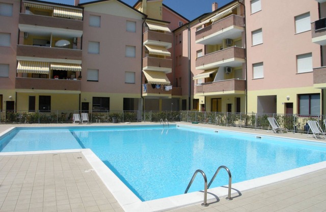Holiday apartment with pool near the beach